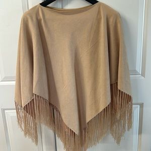 Light weight fringed, cape. Fitting most sizes. The feel of suede beautiful